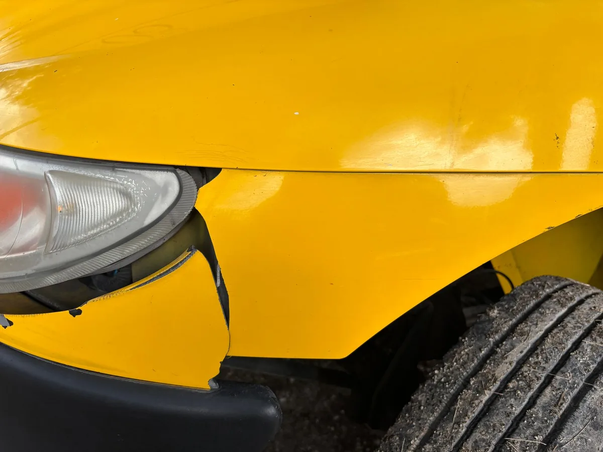 Car panel before denting and repainting, with visible dent