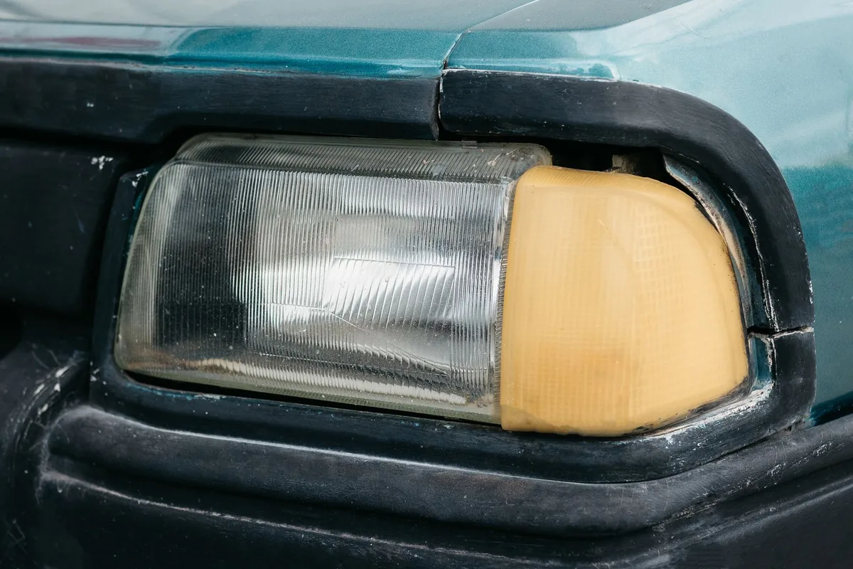 Headlight before restoration, hazy and yellowed